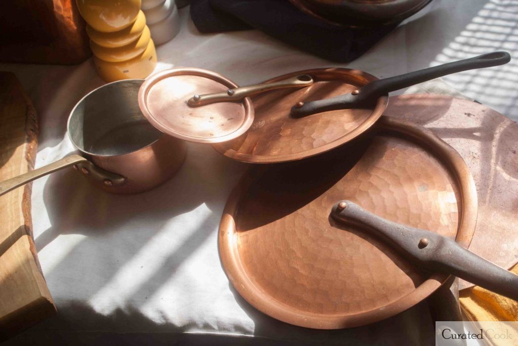 A variety of vintage copper lids